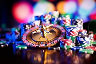 Live casino floor with multiple blackjack and roulette tables